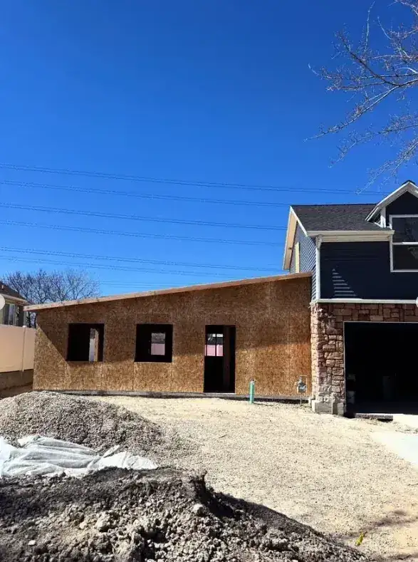 Wide view of a house addition in progress by Frame Platinum LLC