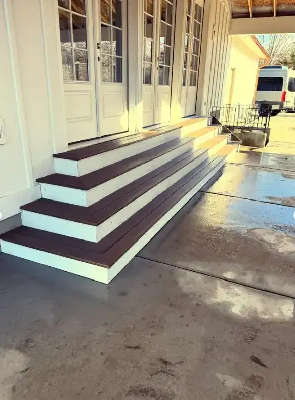 Front stairs outside French doors by Frame Platinum LLC